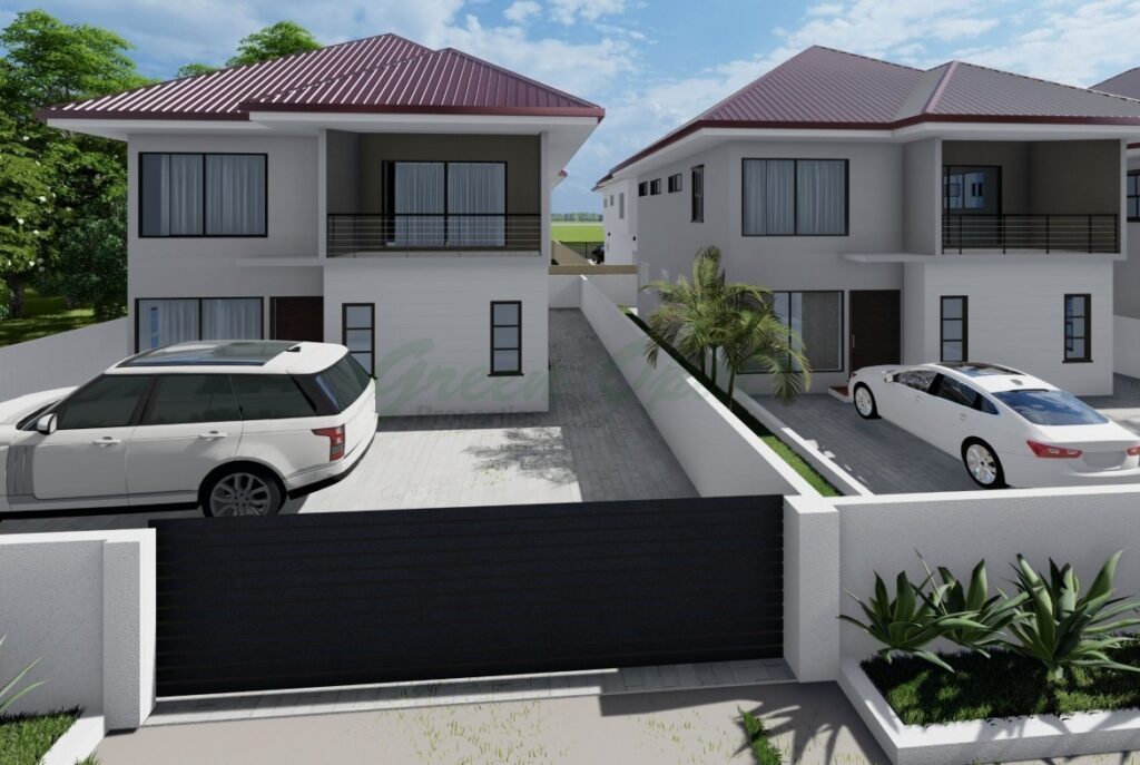 Modern two-story houses with white exteriors and dark roofs separated by a fence.
